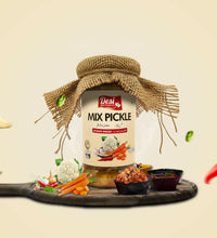 Jar of Desi Mix Pickle with burlap bow on a wooden board with vegetables, on a beige background