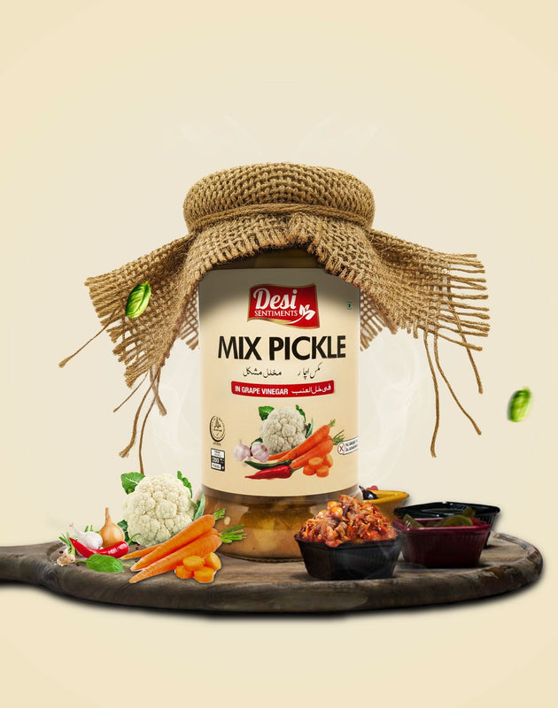 Jar of Desi Mix Pickle with burlap bow on a wooden board with vegetables, on a beige background